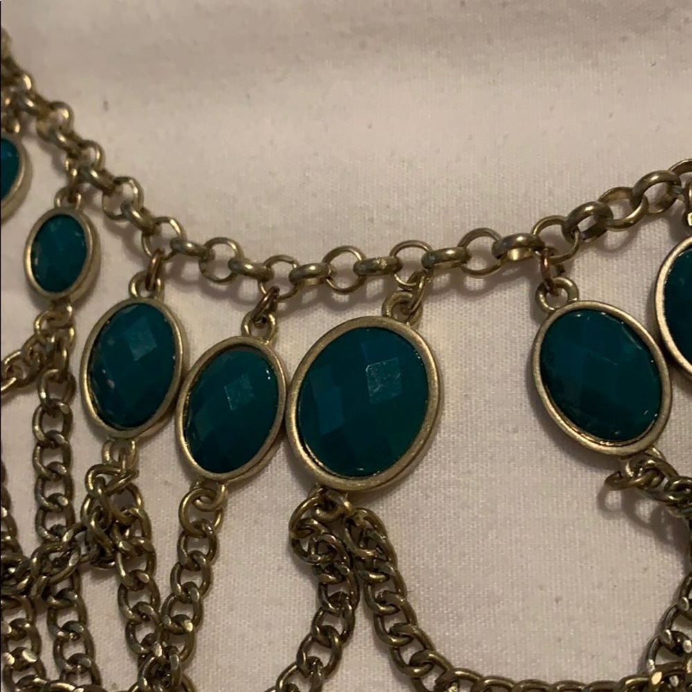 Green and gold colored necklace and earrings